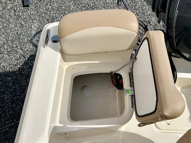 Slide: The Image of 2023 Scout 175 Sportfish boat seat with open storage compartment. - 12