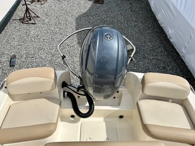 Slide: The Image of 2023 Scout 175 Sportfish boat with Yamaha outboard motor and beige seating. - 13