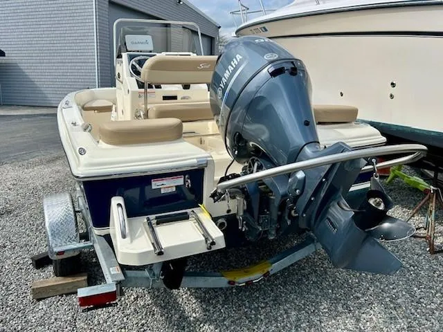 Slide: The Image of 2023 Scout 175 Sportfish boat with Yamaha outboard motor on a trailer. - 15