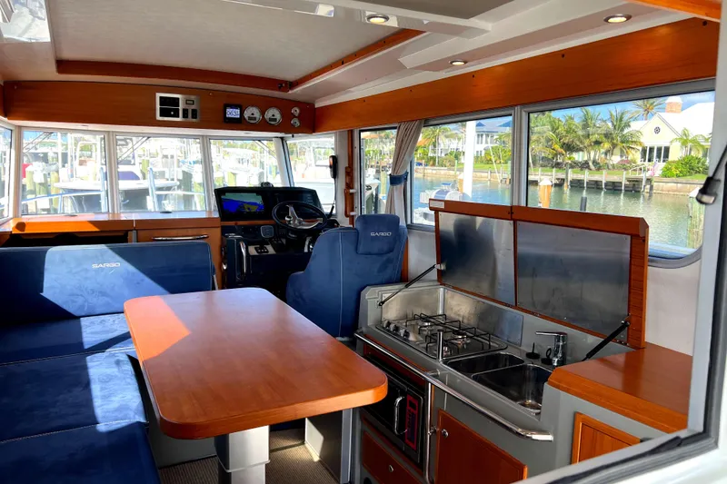 Slide: The Image of Interior of 2019 Sargo 33 All Season boat with seating and kitchen area. - 10