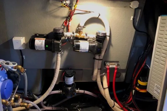 Slide: The Image of Engine room of 2019 Sargo 33 All Season boat with visible wiring and plumbing. - 12