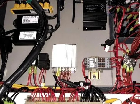 Slide: The Image of Electrical components and wiring inside a 2019 Sargo 33 All Season boat. - 13