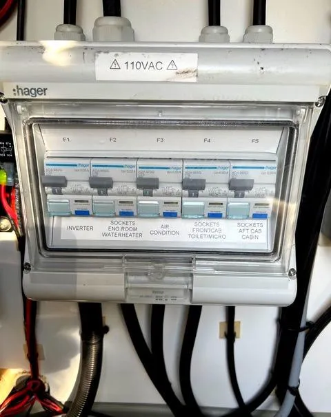 Slide: The Image of Electrical panel on a 2019 Sargo 33 All Season boat, labeled for various sockets and appliances. - 16