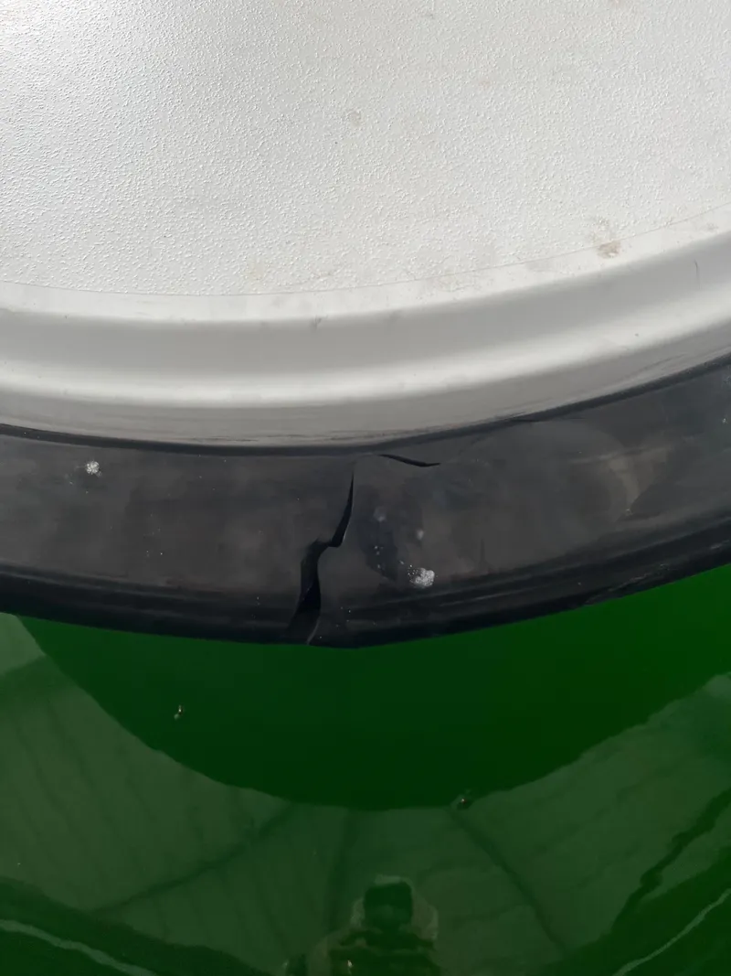 Slide: The Image of Close-up of a cracked rubber seal on a 2019 Sargo 33 All Season boat. - 19