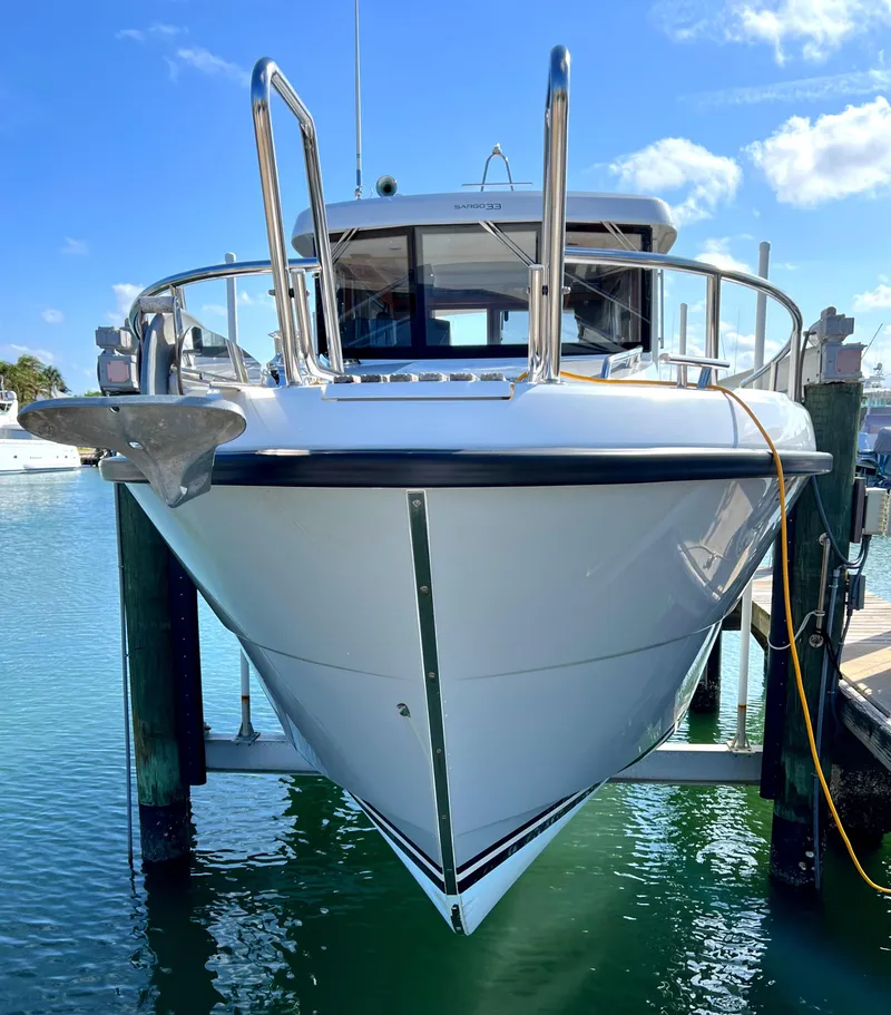 Slide: The Image of 2019 Sargo 33 All Season boat docked at marina, front view. - 5