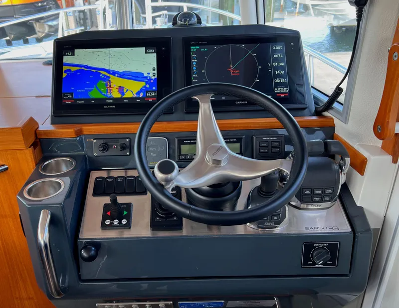 Slide: The Image of 2019 Sargo 33 All Season helm with navigation screens and controls. - 9