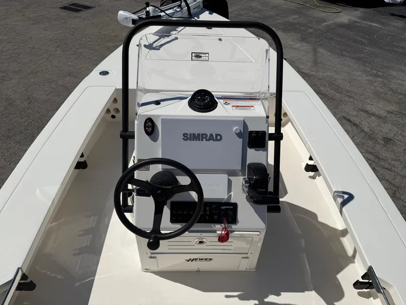 Slide: The Image of 2024 Hewes 18 Redfisher boat interior with Simrad navigation system. - 7