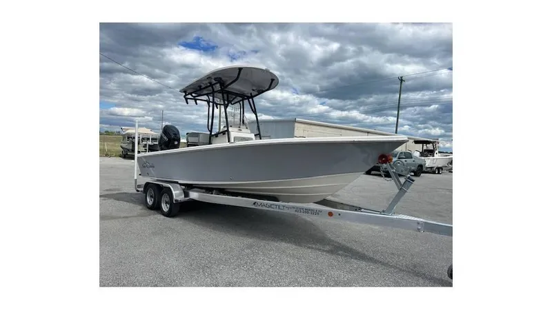 The Image of 2024 Sea Chaser 23 LX boat on trailer under cloudy sky. - 0