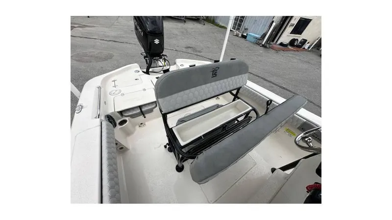 Slide: The Image of 2024 Sea Chaser 23 LX boat interior with seating and storage features. - 10