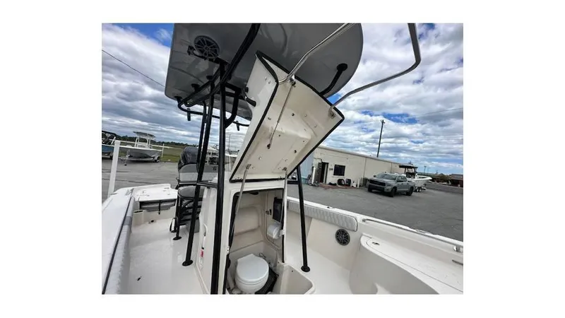 Slide: The Image of 2024 Sea Chaser 23 LX boat with open console and visible toilet. - 13