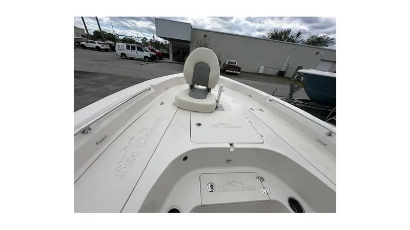 Slide: The Image of 2024 Sea Chaser 23 LX boat interior with seating and storage compartments. - 15