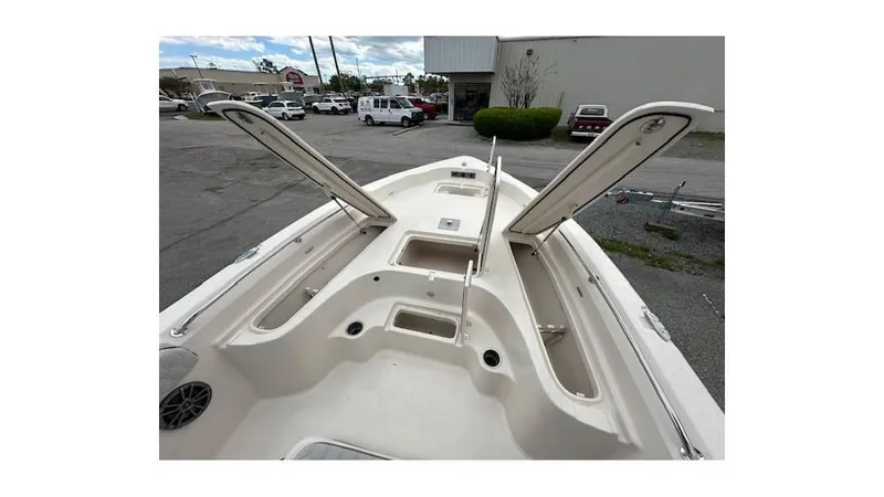 Slide: The Image of 2024 Sea Chaser 23 LX boat interior with open storage compartments. - 18