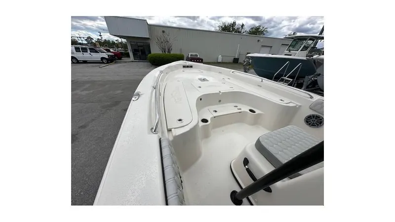 Slide: The Image of 2024 Sea Chaser 23 LX boat deck, spacious seating, and storage area. - 19