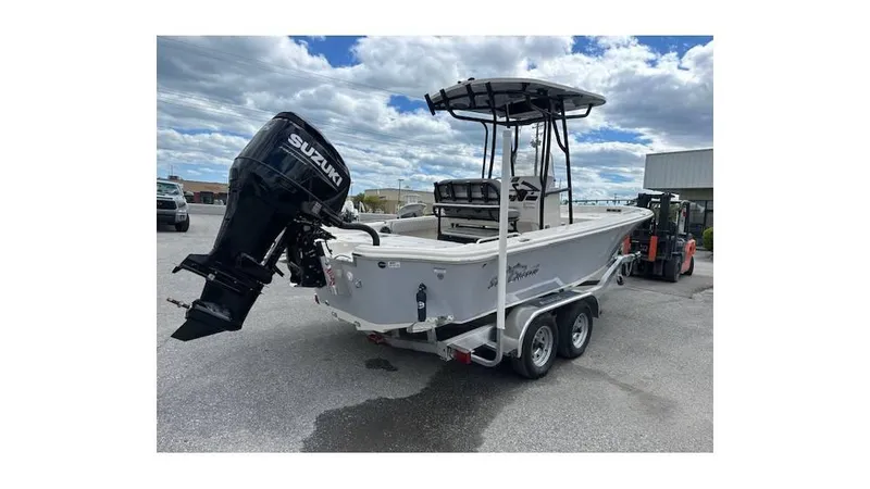 Slide: The Image of 2024 Sea Chaser 23 LX boat with Suzuki outboard motor on trailer. - 3