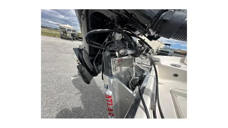 Slide: The Image of 2024 Sea Chaser 23 LX boat engine detail, showcasing motor and hydraulic components. - 4