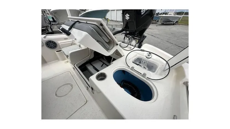 Slide: The Image of 2024 Sea Chaser 23 LX boat interior with storage and livewell features. - 5