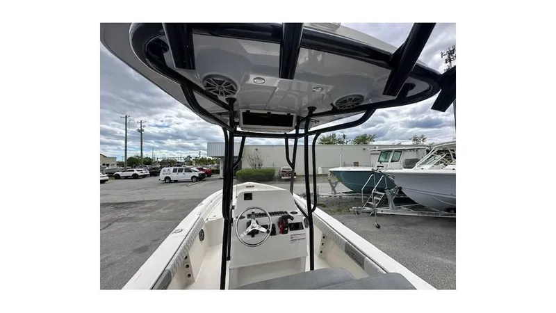 Slide: The Image of 2024 Sea Chaser 23 LX boat interior with steering console and T-top. - 7