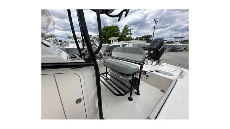 Slide: The Image of 2024 Sea Chaser 23 LX boat interior with seating and console. - 9