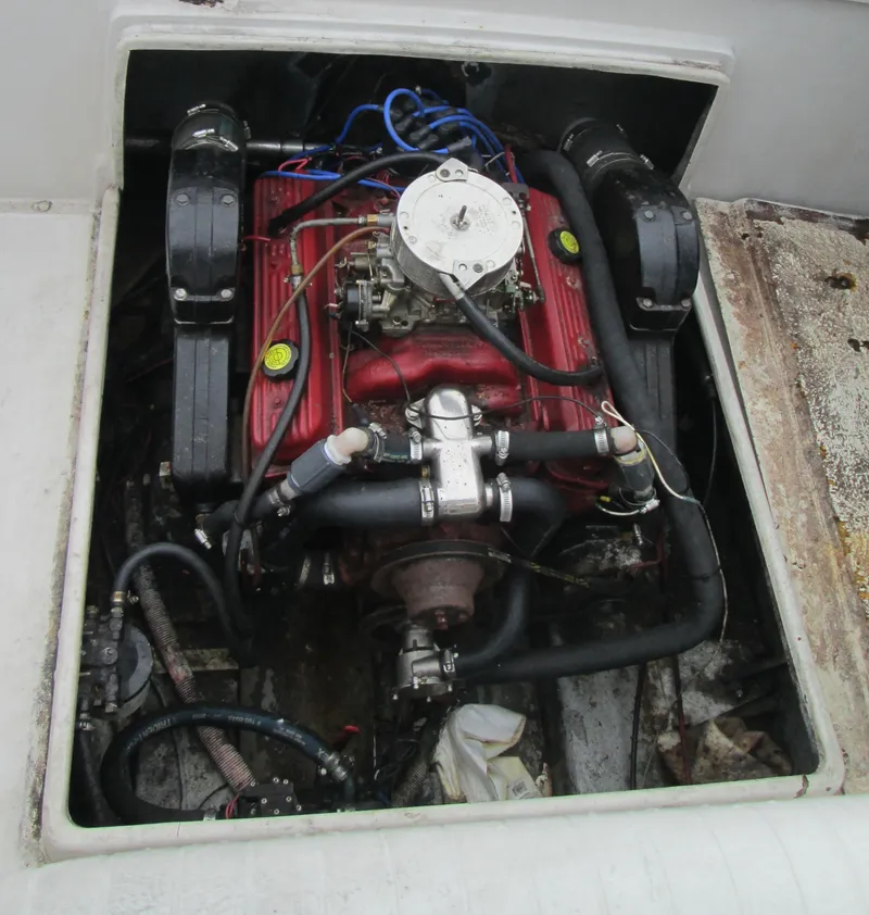 Slide: The Image of 1977 SeaCraft SF 23 IO engine compartment with visible red engine and components. - 4