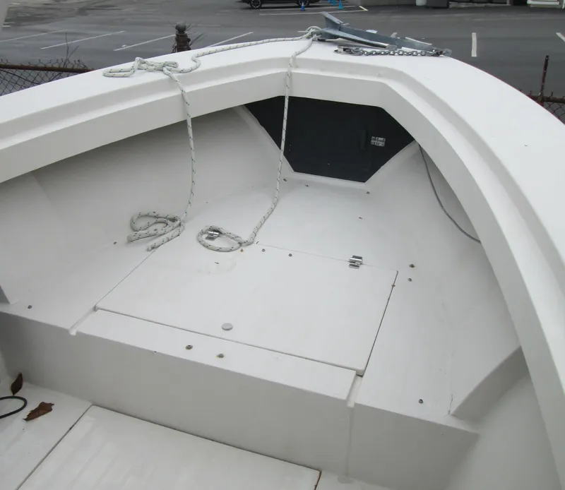 Slide: The Image of 1977 SeaCraft SF 23 IO boat interior with ropes and storage compartment. - 5