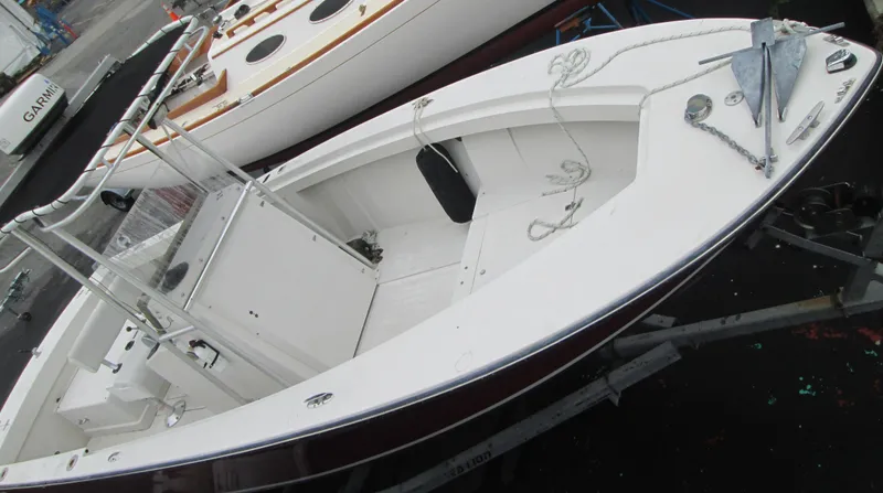 Slide: The Image of 1977 SeaCraft SF 23 IO boat on trailer, white deck, visible anchor and ropes. - 9