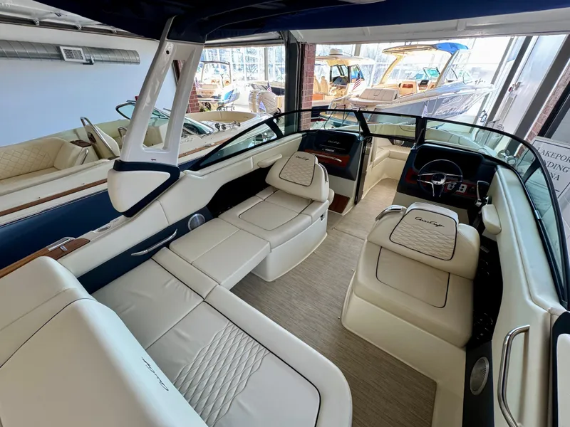 Slide: The Image of Luxurious interior of 2025 Chris-Craft Sportster 25 boat with elegant seating and dashboard. - 10