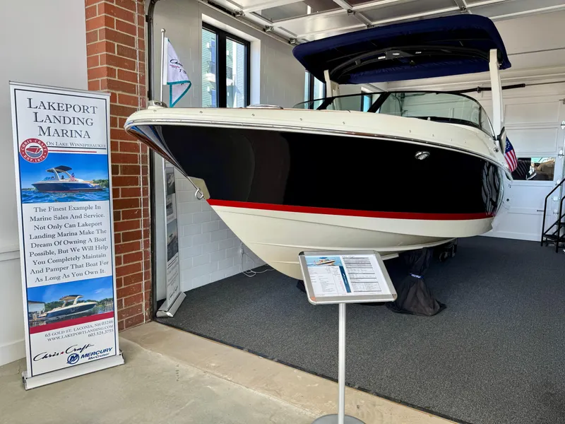 Slide: The Image of 2025 Chris-Craft Sportster 25 boat displayed at Lakport Landing Marina showroom. - 11