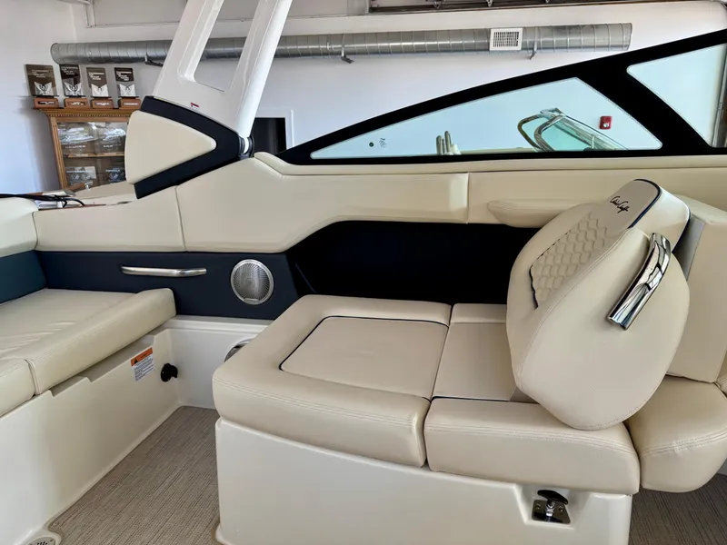 Slide: The Image of 2025 Chris-Craft Sportster 25 interior with luxurious beige seating and modern design. - 13