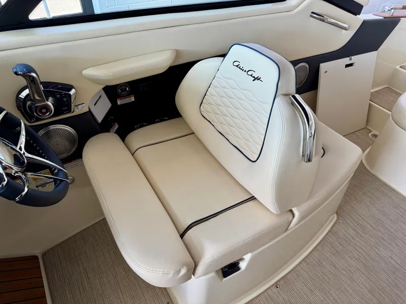 Slide: The Image of Luxurious interior of 2025 Chris-Craft Sportster 25, featuring elegant white seating and modern controls. - 15