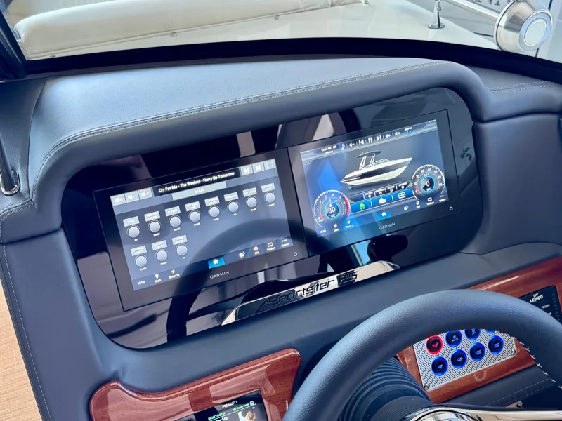 Slide: The Image of 2025 Chris-Craft Sportster 25 dashboard with modern digital displays and controls. - 22