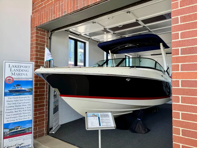 Slide: The Image of 2025 Chris-Craft Sportster 25 boat displayed at Lakeport Landing Marina showroom. - 29