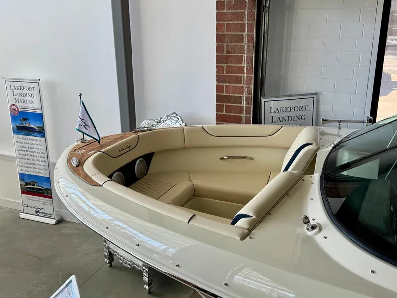 Slide: The Image of 2025 Chris-Craft Sportster 25 boat interior with beige seating at Lakeport Landing Marina. - 3