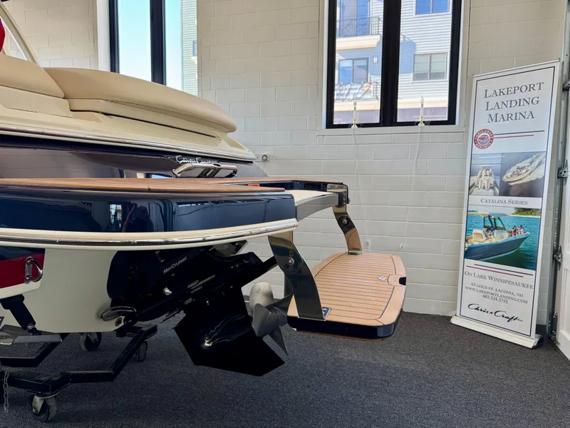 Slide: The Image of 2025 Chris-Craft Sportster 25 displayed at Lakeport Landing Marina showroom. - 7