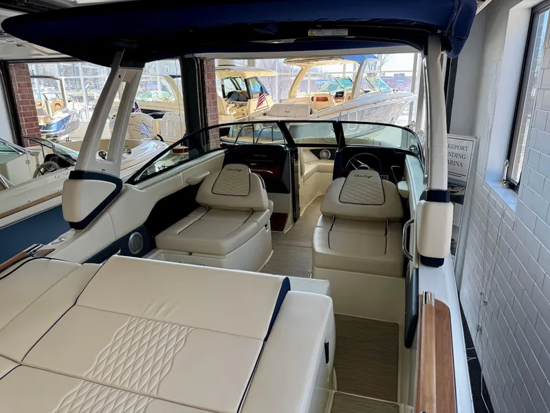 Slide: The Image of 2025 Chris-Craft Sportster 25 interior with luxurious seating and modern design. - 9