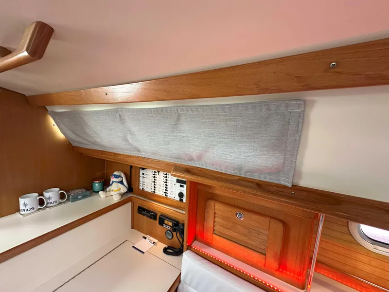Slide: The Image of Interior of 2007 Catalina 34 MkII sailboat with wooden cabinetry and control panel. - 16