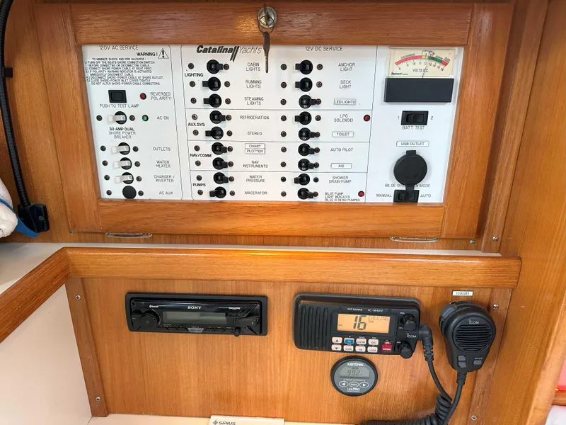 Slide: The Image of Electrical control panel of a 2007 Catalina 34 MkII sailboat with radio and stereo system. - 18
