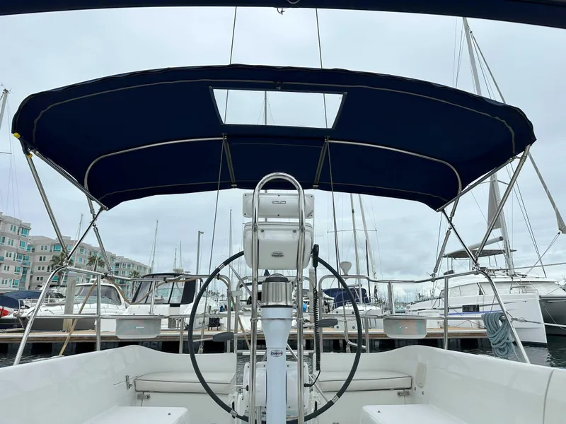 Slide: The Image of 2007 Catalina 34 MkII sailboat cockpit with blue canopy at marina. - 2