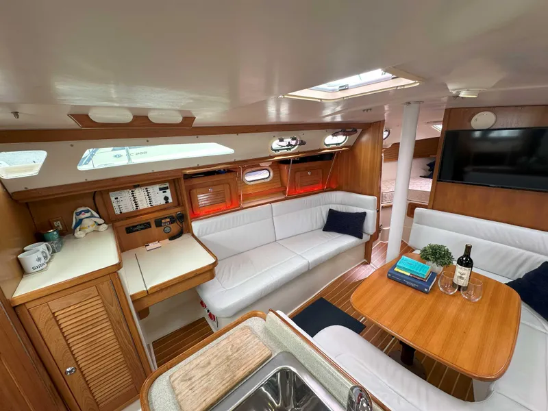 Slide: The Image of Interior of 2007 Catalina 34 MkII sailboat with cozy seating and wooden finishes. - 20