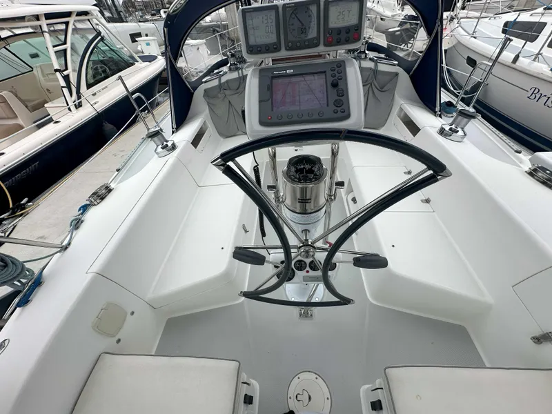 Slide: The Image of Cockpit of 2007 Catalina 34 MkII sailboat with navigation instruments and steering wheel. - 3
