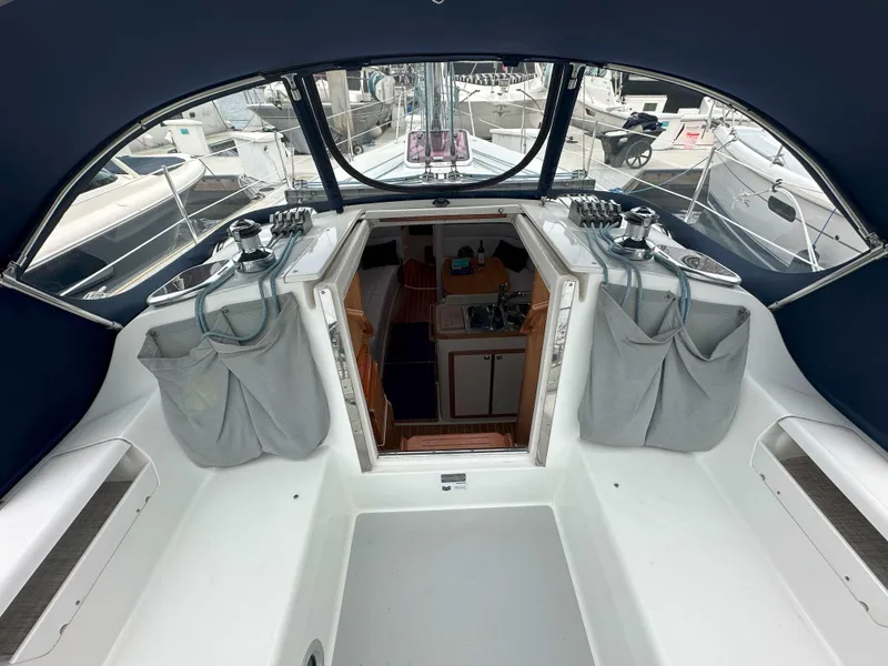 Slide: The Image of 2007 Catalina 34 MkII sailboat cockpit with open cabin entrance and winches. - 4