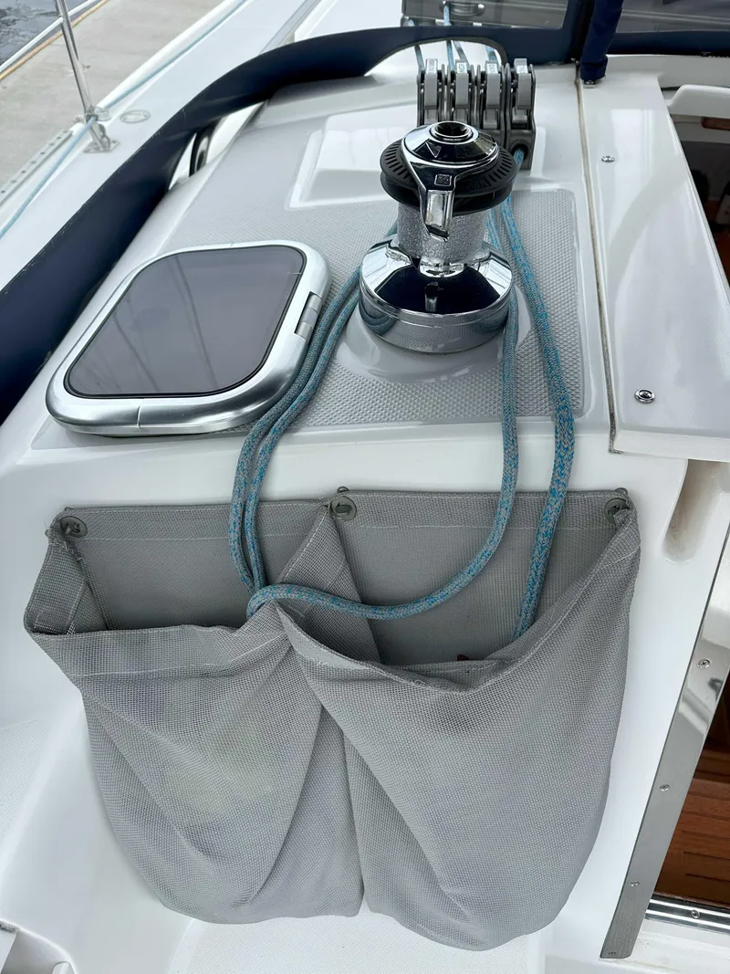Slide: The Image of Catalina 34 MkII sailboat deck with winch, ropes, and storage pockets, 2007 model. - 5