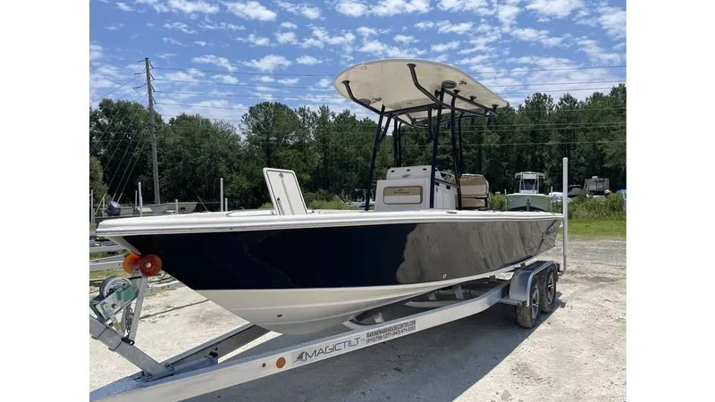Slide: The Image of 2023 Sea Chaser 23 LX boat on trailer under clear sky. - 3