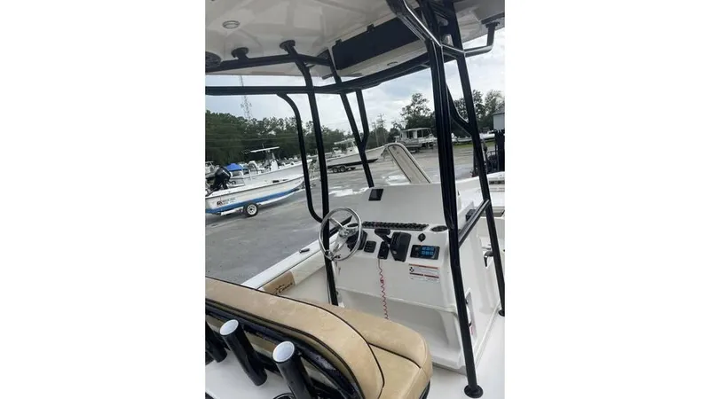 Slide: The Image of 2023 Sea Chaser 23 LX boat interior with steering console and seating. - 7