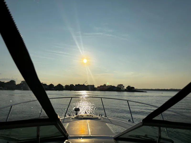 Slide: The Image of 2007 Sea Ray 290 Sundancer cruising at sunset on a calm lake. - 5