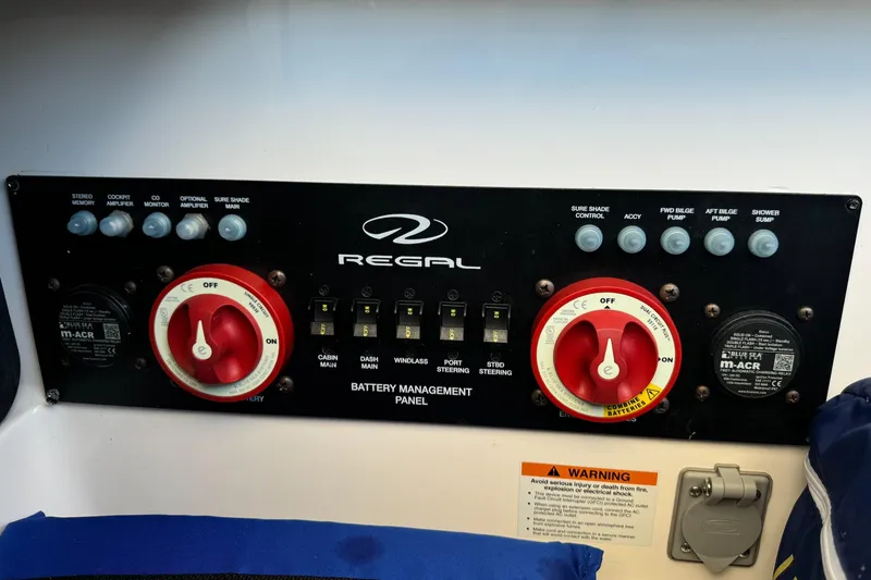 Slide: The Image of Battery management panel of 2018 Regal 29 OBX boat with control switches. - 10