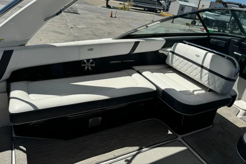 Slide: The Image of 2018 Regal 29 OBX boat interior with white and black seating. - 11