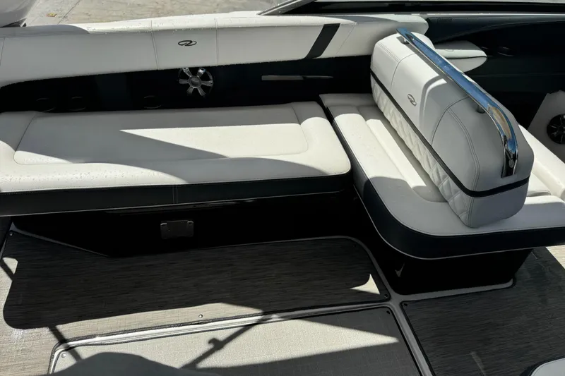 Slide: The Image of 2018 Regal 29 OBX boat interior with white and black seating. - 12