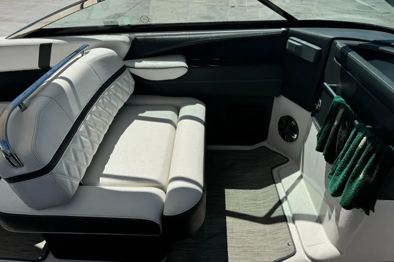 Slide: The Image of Interior of 2018 Regal 29 OBX boat with white seating and modern design. - 13