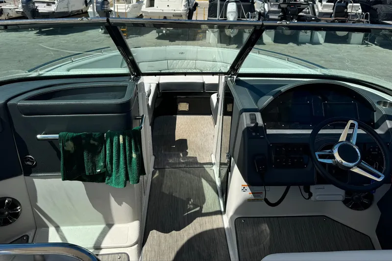 Slide: The Image of 2018 Regal 29 OBX boat interior with steering wheel and dashboard. - 14