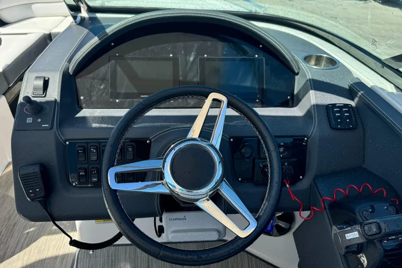 Slide: The Image of Steering wheel and dashboard of 2018 Regal 29 OBX boat. - 18
